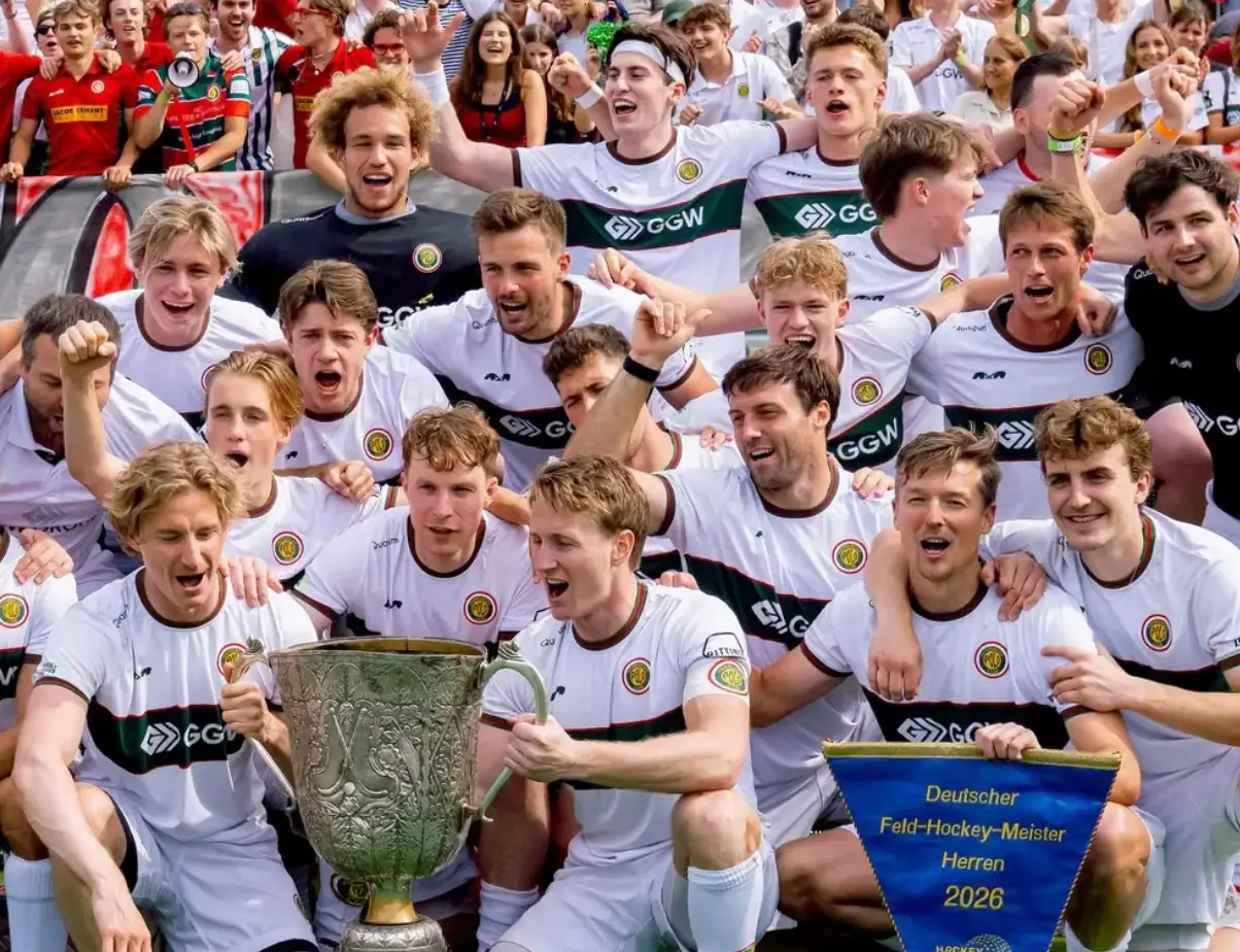 Men's team with the trophy after winning the 2026 German field hockey championship