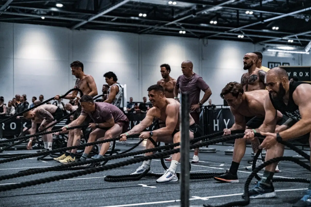 HYROX athletes on the battle ropes